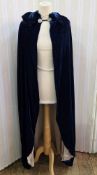 A blue velvet 1920's opera cloak labelled Rose Brewster Renee Soeurs 14 Hanover Square W1