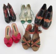 Pair of platform soled walking shoes in black and tan leather, Elton John style, a pair of