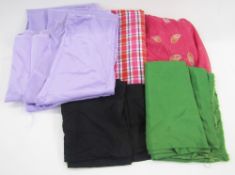 Assorted fabrics to include a good length of green baize, pink and blue check fabric, printed