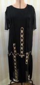 A 1920's crepe and chiffon black dress labelled Edwin Powell & Son, Shrewsbury, the drop waist