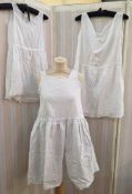 A selection of late Victorian undergarments, petticoats, to include white cotton undergarments,