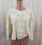 An Indian style satin blouse, the front embroidered with faux pearls and mirrored decoration, a lace