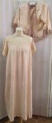 A 1920's/30's apricot satin nightgown with square lace neckline and lace detail to the short