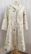 A silk embroidered modern coat labelled Corner Shop Designers made in Gloucestershire, ideal for a