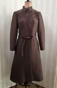 A brown slub satin coat, front zip fastening and brown tie belt, brown embroidered, Nehru collar,