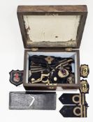 Collection of Royal and Merchant Naval cloth insignia including officers cap badge, two British