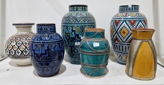 Group of contemporary Moroccan pottery vases, painted with foliate bands, lozenges and lappet-shaped