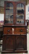 19th century mahogany secretaire bookcase, the upper section with two arched glazed doors opening to