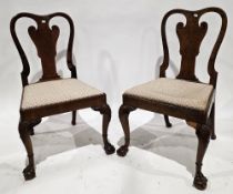 Pair of early 18th century Queen Anne walnut side chairs, shaped backs with shaped solid splats,