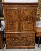 19th century figured walnut and mulberry wood linenpress, the moulded cornice over two panel doors