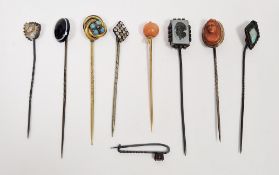 Collection of eight 19th / early 20th century stickpins including hematite intaglio pin, gold