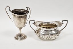 Silver two-handled sugar by Nathan & Hayes, Chester 1896 of oval gadrooned form, 9cm high and a