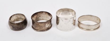 Heavy silver napkin ring by Reid & Sons, London 1922, of plain polished circular form, another