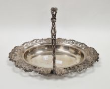 Silver swing-handled basket by William Hutton & Sons, London 1910, of oval form, the pierced