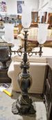Pair of French japanned and gilt metal candelabra floor lamps in the Napoleon III style, having