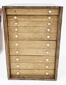 Edwardian oak table top collector's cabinet containing a large number of wax and glass seals, mostly