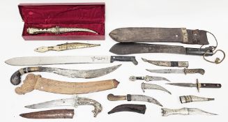 Collection of knives, daggers and machetes including Indo-Persian Khanjar daggers, Jambiya