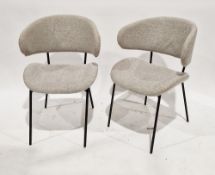 Pair of Wera dining chairs, the curved backs and seats upholstered in a natural fabric, on black