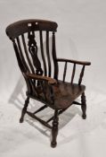 19th century ash and elm lathback elbow chair with pierced carved splat, saddle seat, on turned