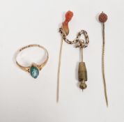 19th century gold-coloured stickpin, the coral terminal carved as a mans head, another stickpin