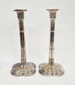 Pair of George III neo-gothic silver candlesticks, makers mark I.C, London 1767, modelled as four