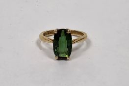 18ct yellow gold and green tourmaline ring, claw-set with a mixed cut oval tourmaline (approx.11.