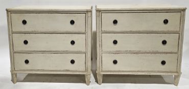 Pair of cream distressed painted chests of drawers in the French manner, the rectangular tops with