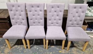 Set of four modern high button back dining chairs upholstered in a lilac-coloured fabric, on beech