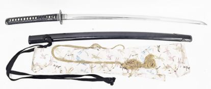 Japanese Wakizashi type sword having a curved single edge blade and a black leather and stingray