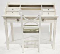 Modern white painted desk, the over stretcher with an arrangement of three pigeonholes and four