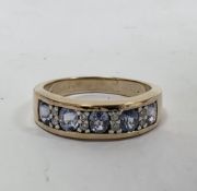 Gold ring set with five sapphires alternating with tiny diamonds, marked 375, finger size N, 3.4g