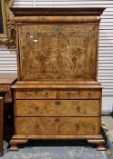 Early 18th century burr walnut and feather banded secretaire chest, the moulded cornice over a