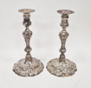 Pair of George III cast silver candlesticks by John Schofield, London 1789, of knopped baluster form