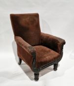 Early 19th century library armchair, the mahogany frame having carved scrolling arms, on front