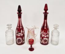 Pair of 19th century Bohemian ruby flashed and engraved decanters and stoppers, decorated with stag,