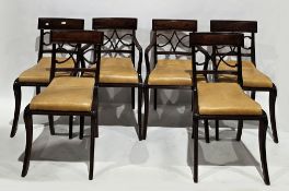 Set of six Regency-style mahogany dining chairs including two carvers, having bar backs, pierced