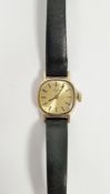 Lady's 9ct gold Tissot wristwatch, rounded rectangular with gilt face, on black strap