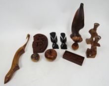 Collection of carved wooden items including apples, bird ornaments, vases, boxed dominoes and