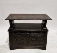 Early 20th century oak monk's bench in the 17th century manner, the top with lunette carving and