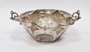 Silver-coloured metal two-handled bowl in the 17th century-style, unmarked, of shaped circular