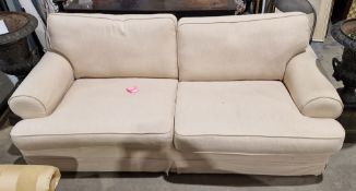 Three-seater sofa upholstered in a natural calico fabric, 84cm high x 213cm wide x 102cm deep