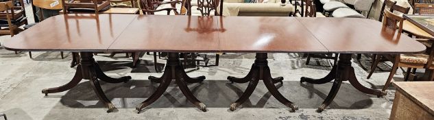 Regency-style mahogany four-pedestal dining table, the two D-ends holding five additional leaves