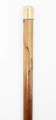Early 20th century gold-mounted walking cane, circa 1909, the malacca shaft capped in 18ct gold