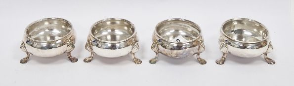 Set of four George II silver circular salts by David Hennell, marks rubbed, but possibly London