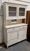 19th century oak dresser, later painted white, the upper section with two doors with mesh panels,
