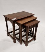 Oak nest of three tables in the 17th century manner, the smallest table with thumb carved frieze, on