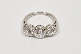 Platinum graduated three-stone diamond ring, the central old brilliant cut stone 1.42ct approx,