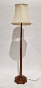 Early 20th century oak standard lamp of square tapered form with chamfered corners, on a stepped