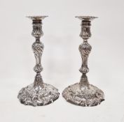 Pair of George II cast silver candlesticks by John Cafe, London 1753, of knopped baluster form on