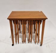 Danish Poul Hundevad mid-century nest of teak tables comprising a rectangular table on castors